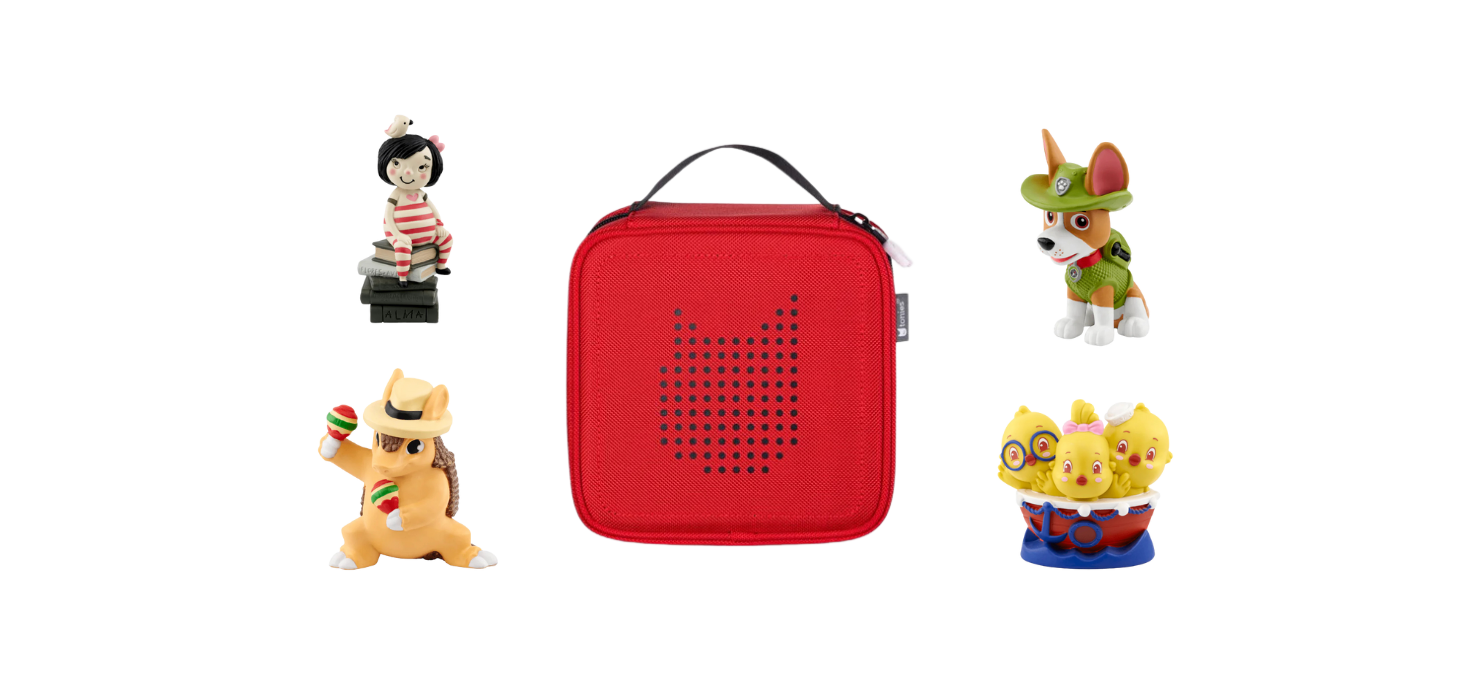 Red carrying case for a Toniebox audio player, surrounded by four Tonies figures: one of a girl on books, a dog in a green outfit (possibly Tracker from PAW Patrol), a hedgehog with maracas, and a group of three chicks in a red bowl.