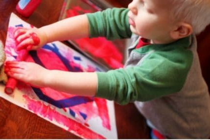 Toddler painting valentine