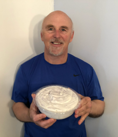 Photo of Chef Rob holding a bowl of Blueberry Crumb Cake Ice Cream.