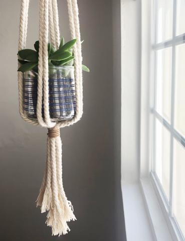 A photo of the tiny plant pot in a hanger.