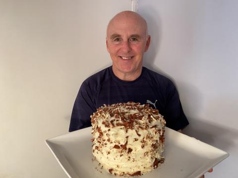 Chef Rob holding a Hummingbird Cake.