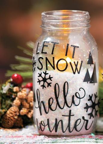 Photo of a winter luminary, which features a decorated jar containing a LED candle.