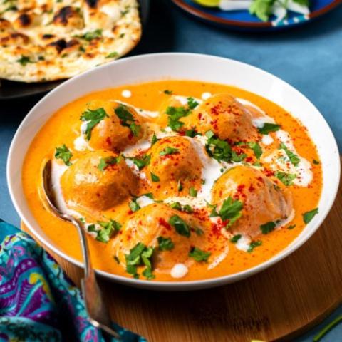 A photo of a bowl filled with Malai Kofta.