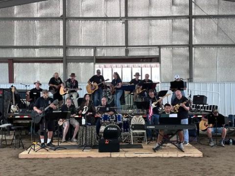 A photo of the band Veterans and Friends performing.