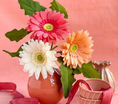 A color photo of daisies made from paper.