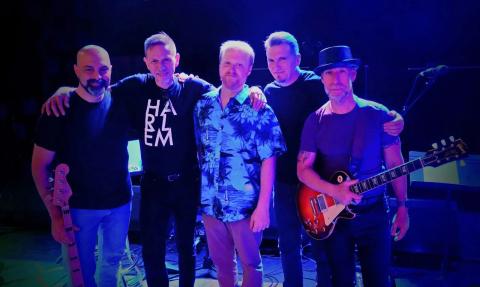 A photo of the band Seconds Out.