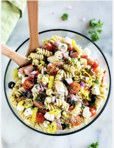 A photo of a bowl of pasta salad with vegetables.