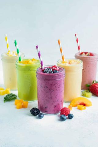 A photo of smoothies in various colors.