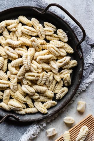 A photo of a pan of cavatelli pasta.