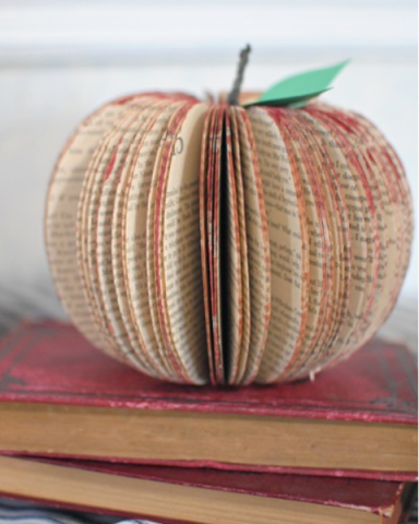 A photo of an apple made from an upcycled book.