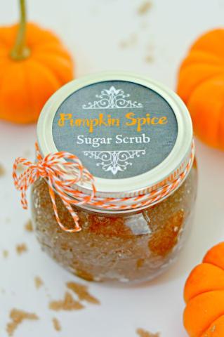 A photo of a jar of pumpkin spice sugar scrub.