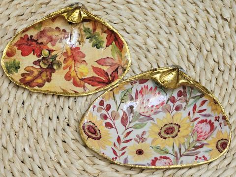 A color photo of decoupage shells with a fall theme.