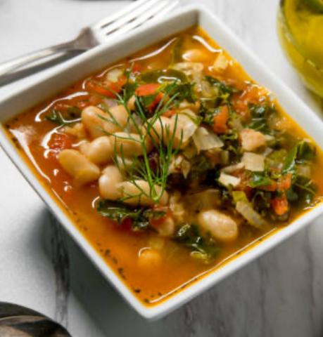 A photo of a bowl of pasta fagioli.