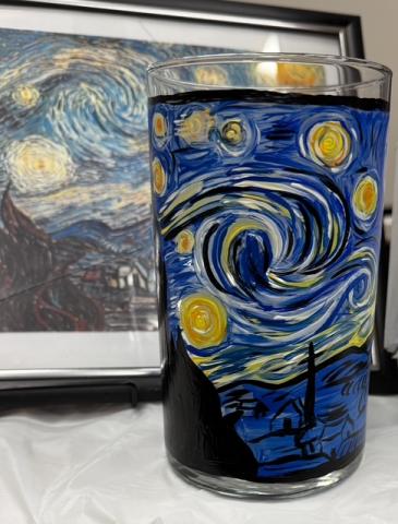 A painted candle holder inspired by Van Gogh's Starry Night.