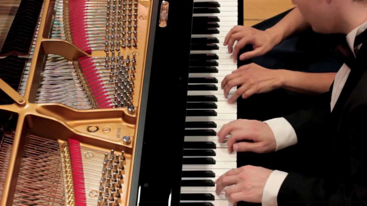 four hands on piano