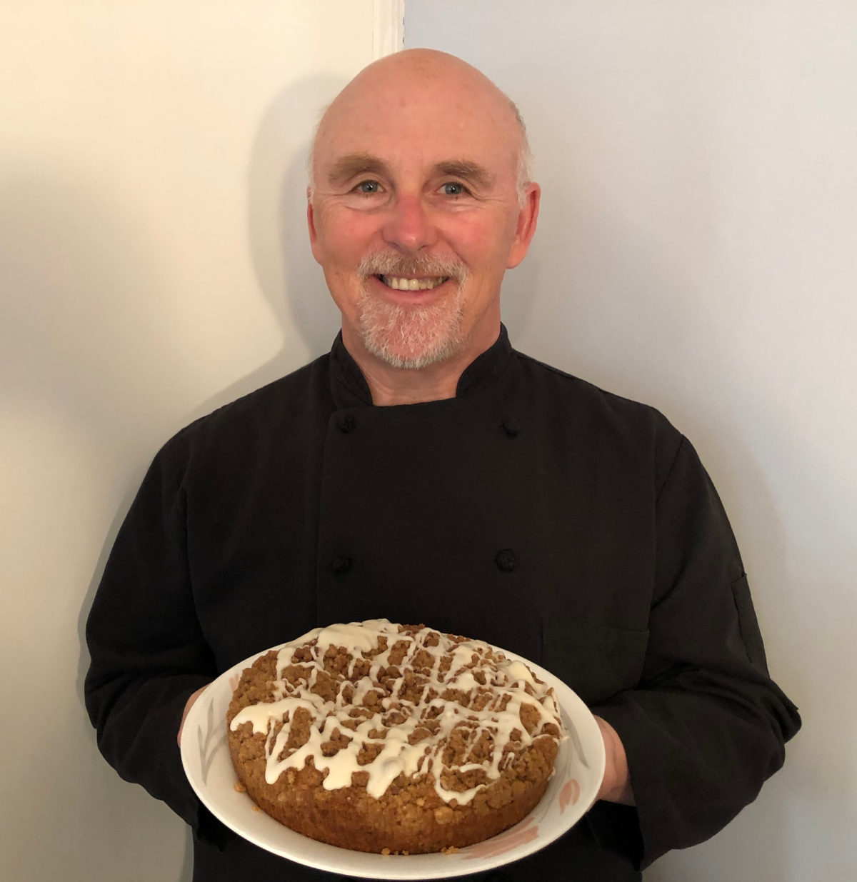 A photo of Chef Rob holding a Cinnamon Spiced Zucchini Crumb Cake.