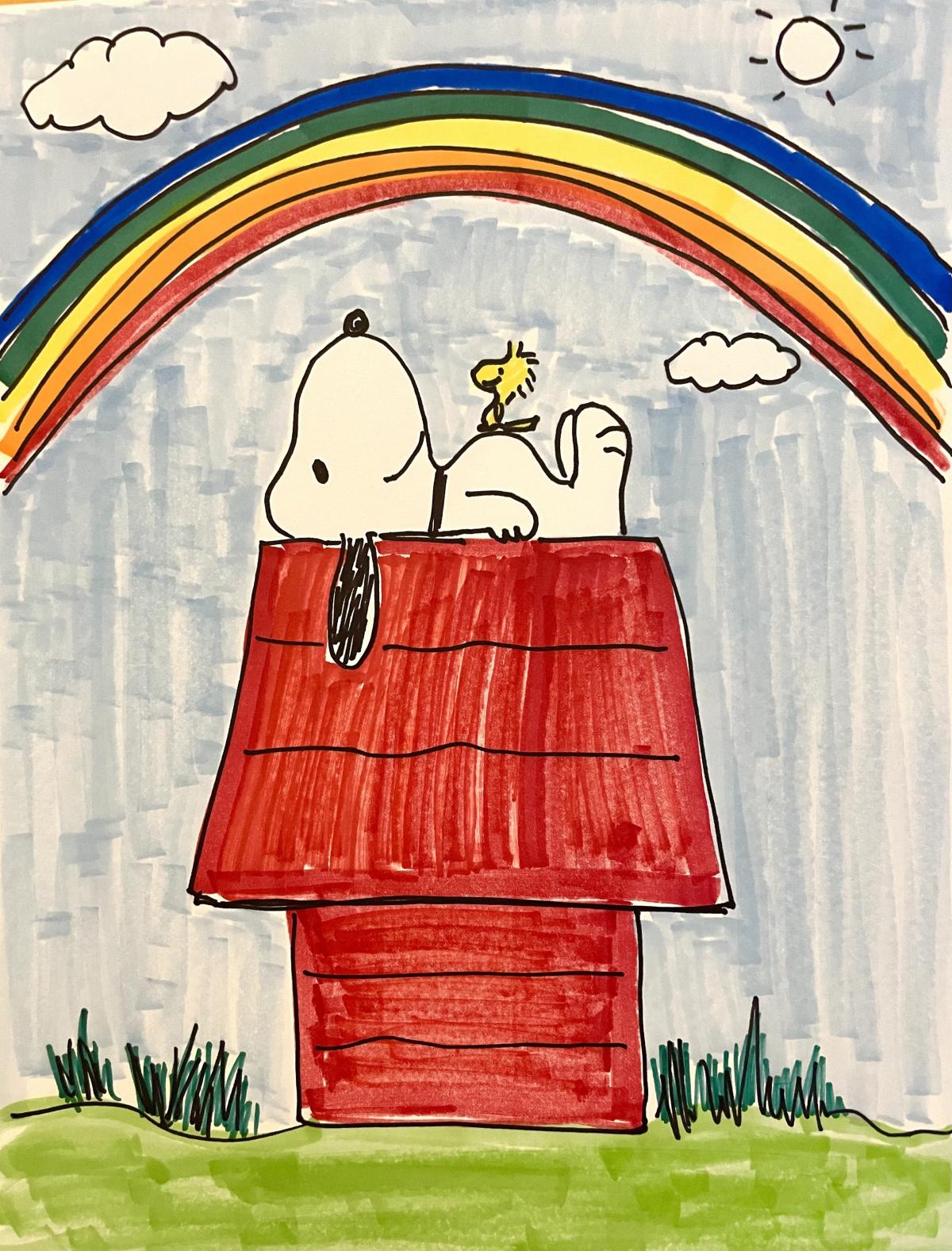 Snoopy on his red doghouse