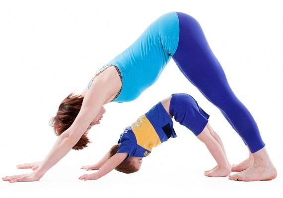 Mom and child doing yoga