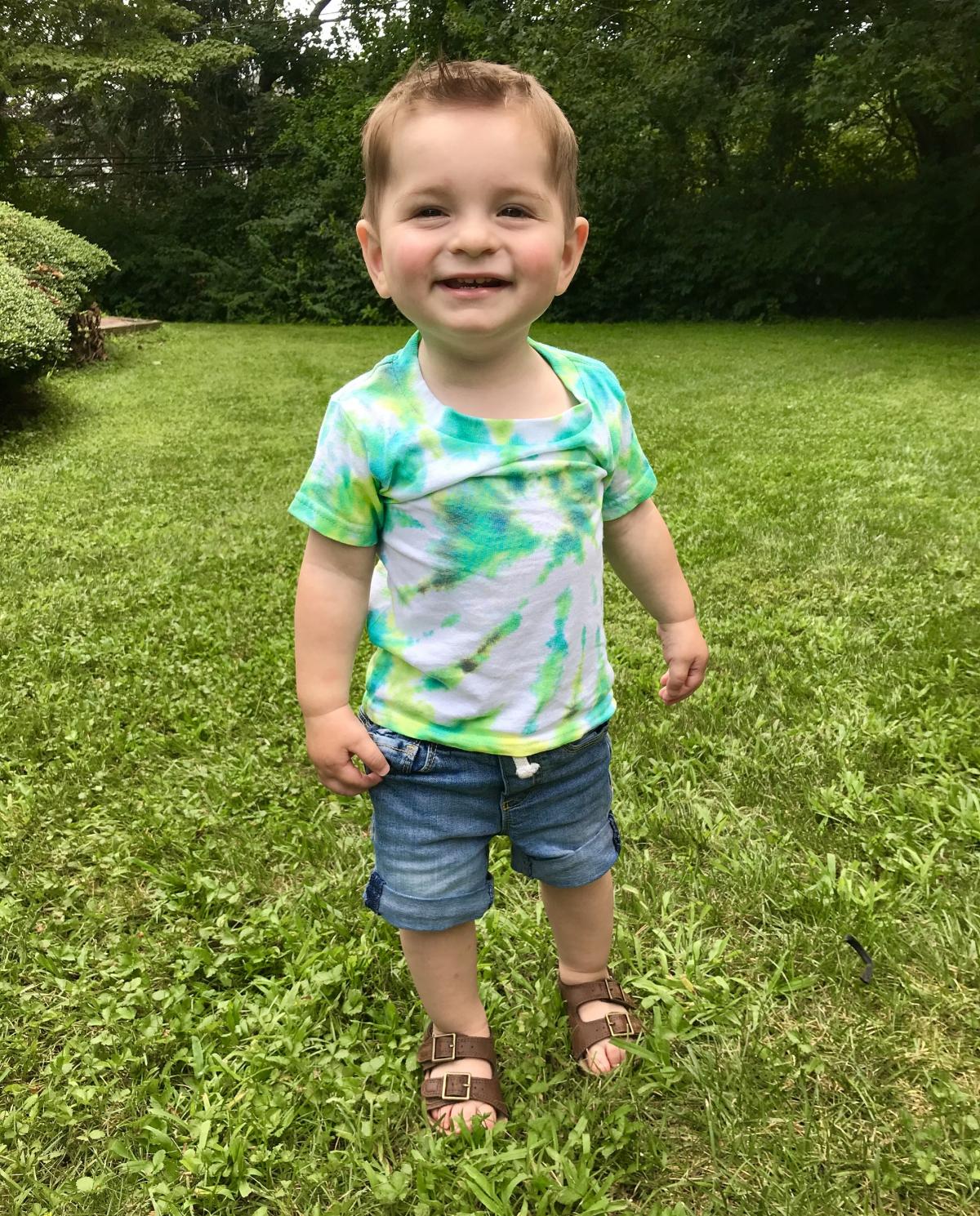 Toddler wearing tie dye shirt