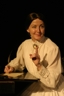 Actress Ginger Grace as Emily Dickinson.