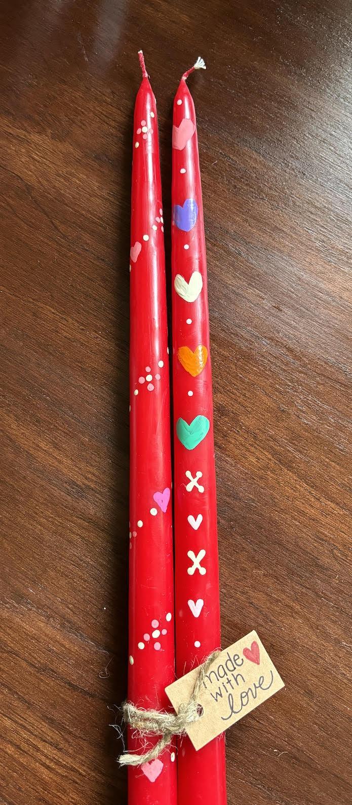 A color photo of hand-painted taper candles.