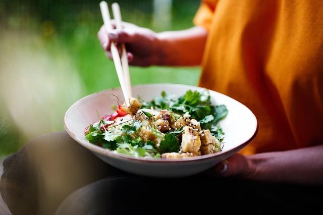 A color photo of a bowl of salad.