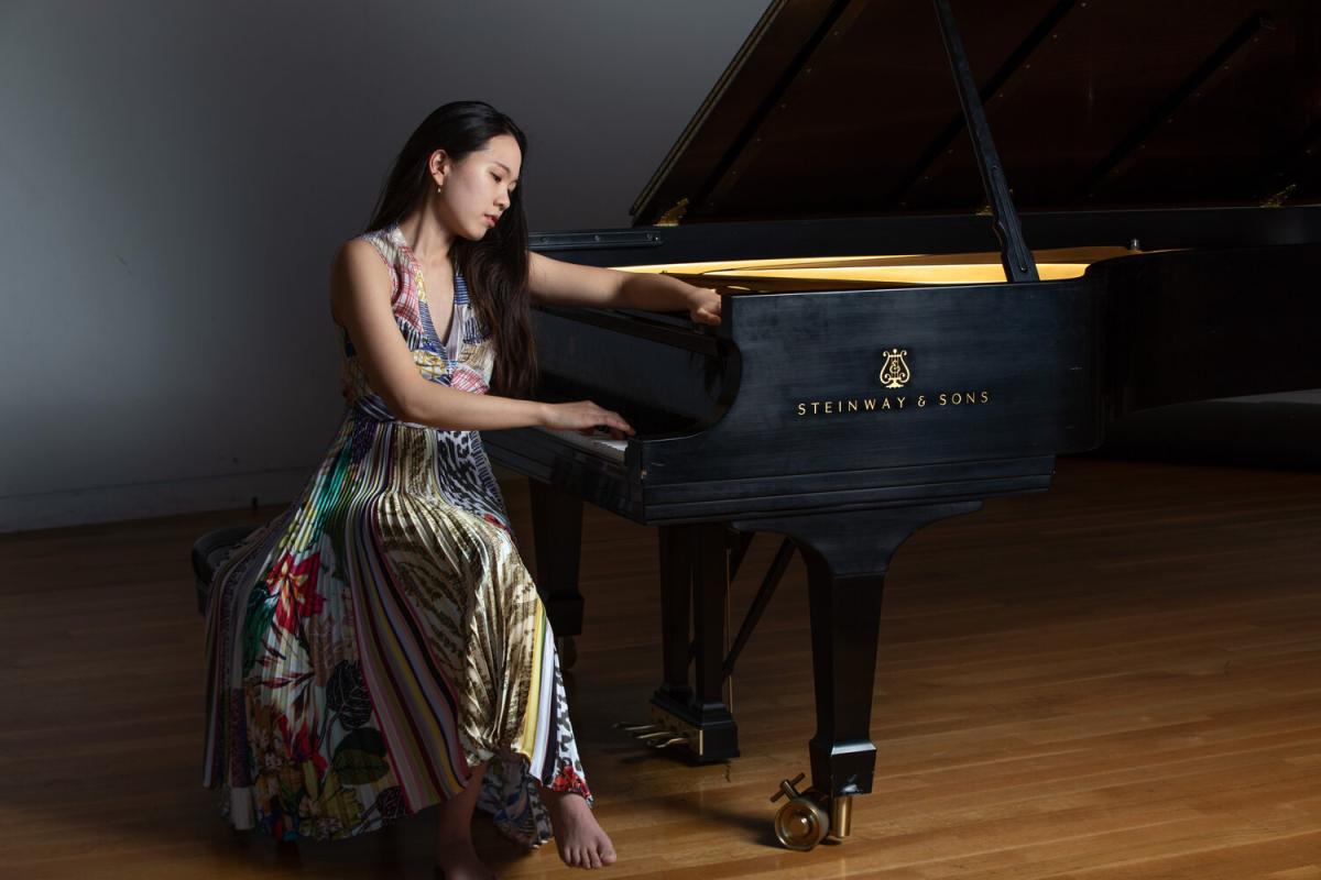A photo of Chaeyoung Park seated at the piano.