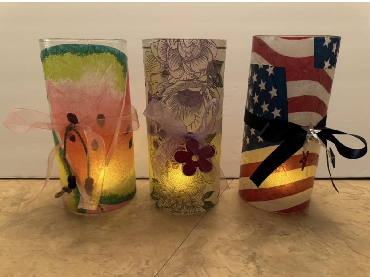 A color photo of three decoupage candle holders.