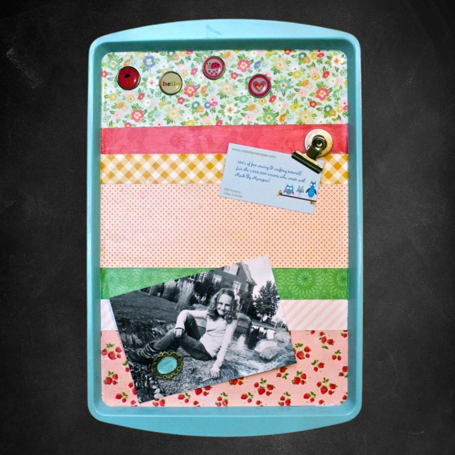 A photo of a magnetic board made from a baking sheet.