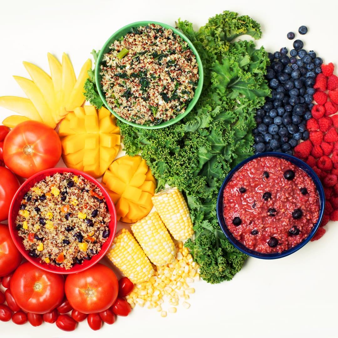 A photo of an array of colorful fruits, vegetables and grains.