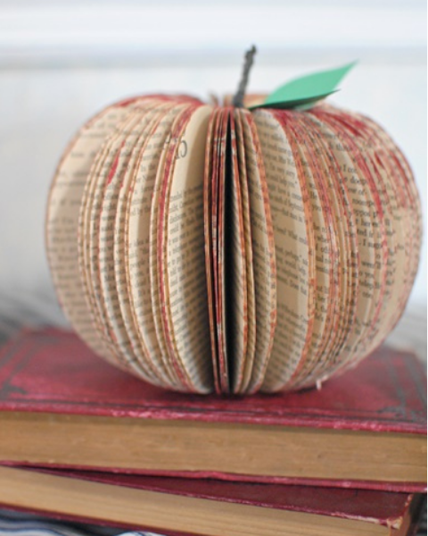 A photo of an apple made from an upcycled book.