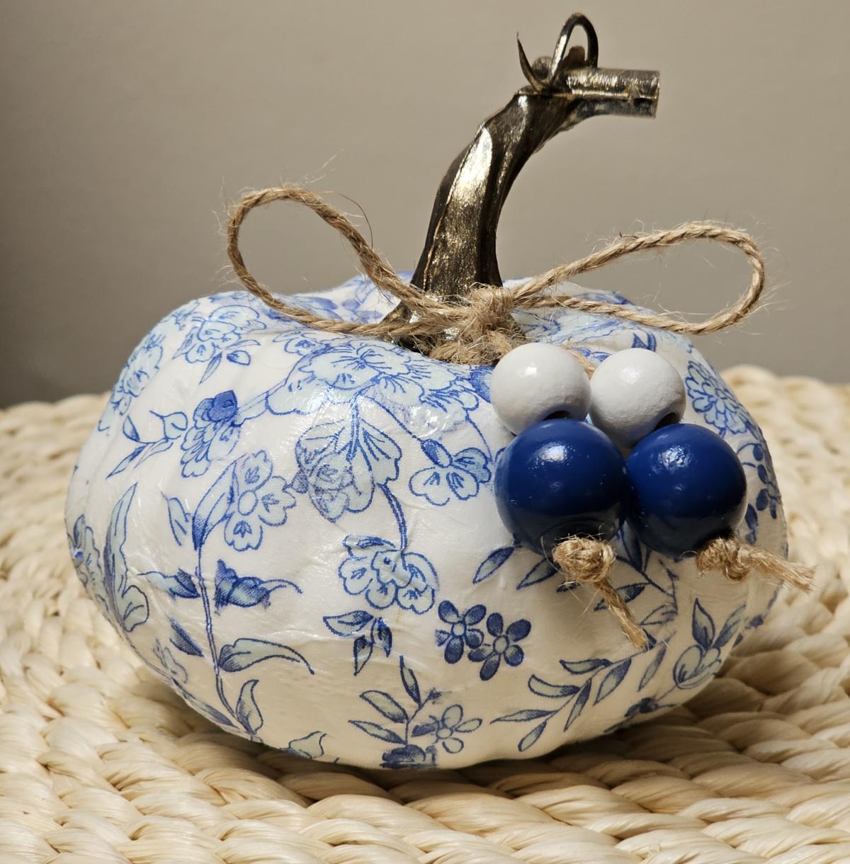 A photo of a decoupage mini pumpkin.