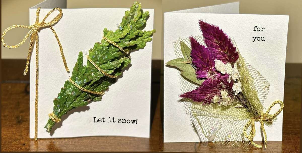 A color photo of two holiday cards embellished with natural accents.