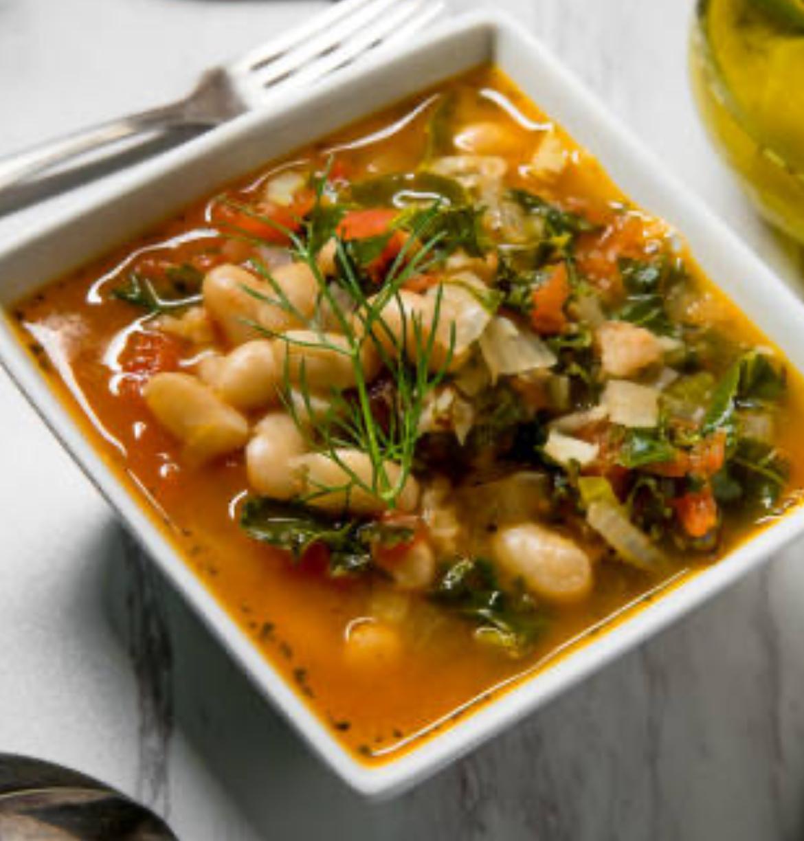 A photo of a bowl of pasta fagioli.