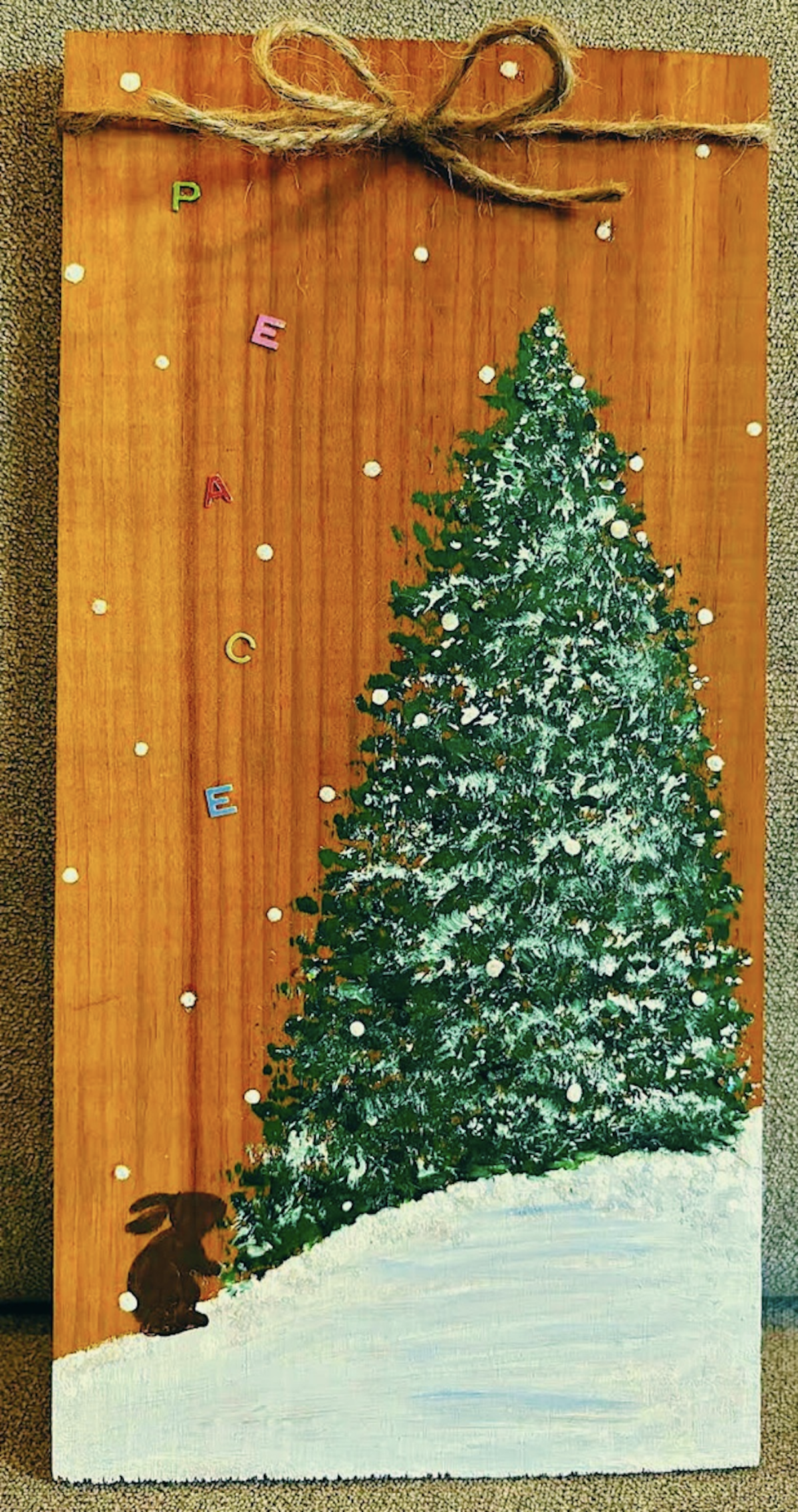 A color photo of a painted woodland scene.