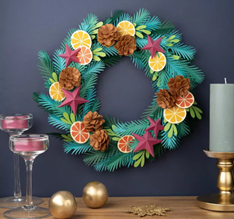 A color photo of a paper holiday wreath.