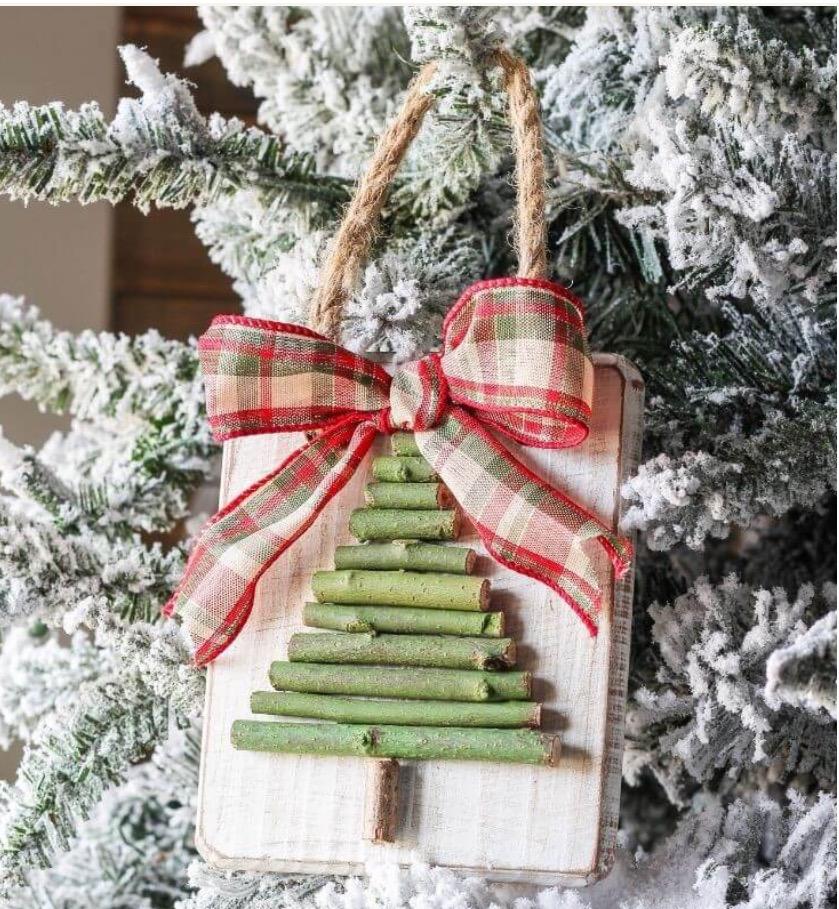 A color photo of a wooden tree ornament.
