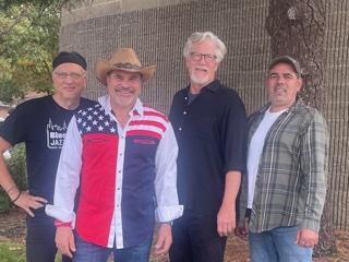 A color photo of the four members of the band The Hambones.