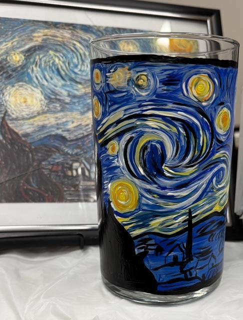 A painted candle holder inspired by Van Gogh's Starry Night.