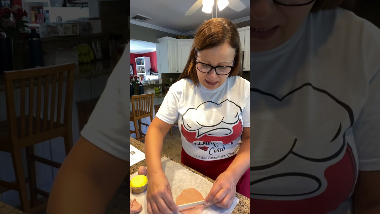 A photo of a partially sliced loaf of cinnamon swirl chocolate chip bread.